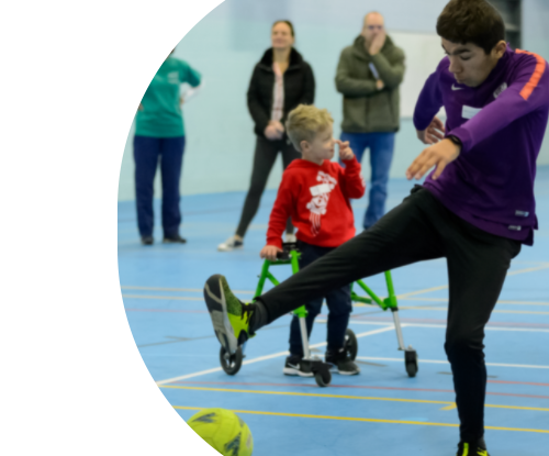 Disabled boy playing football