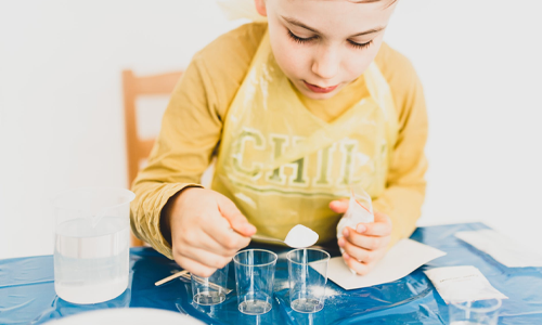 Boy doing science experiment