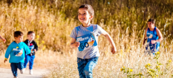 Young Boy Running Cross Country