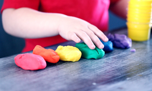 Child making playdough