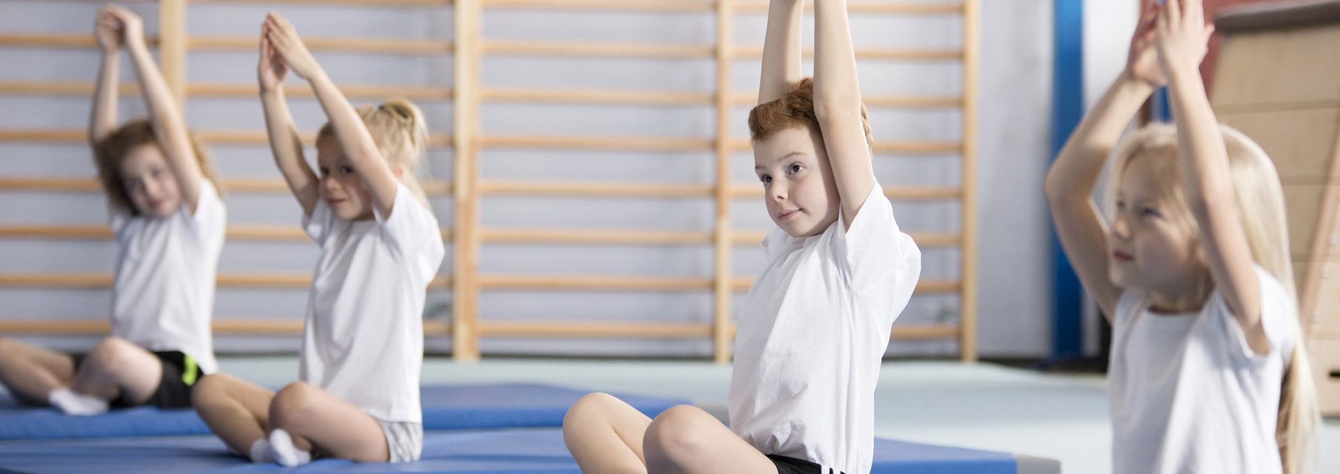 primary kids doing yoga