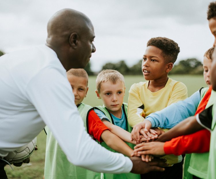 football coach with kids