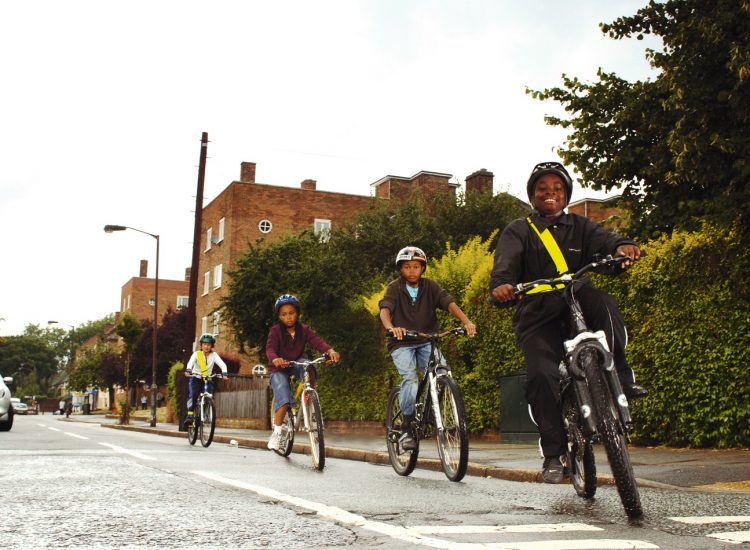 children cycling on the street