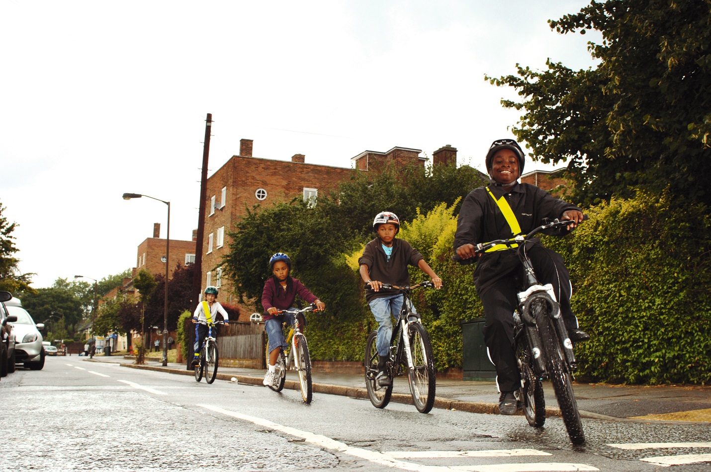 children cycling on the street