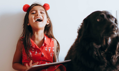 Girl drawing and laughing