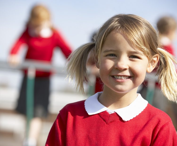 smiling girl in school uniform