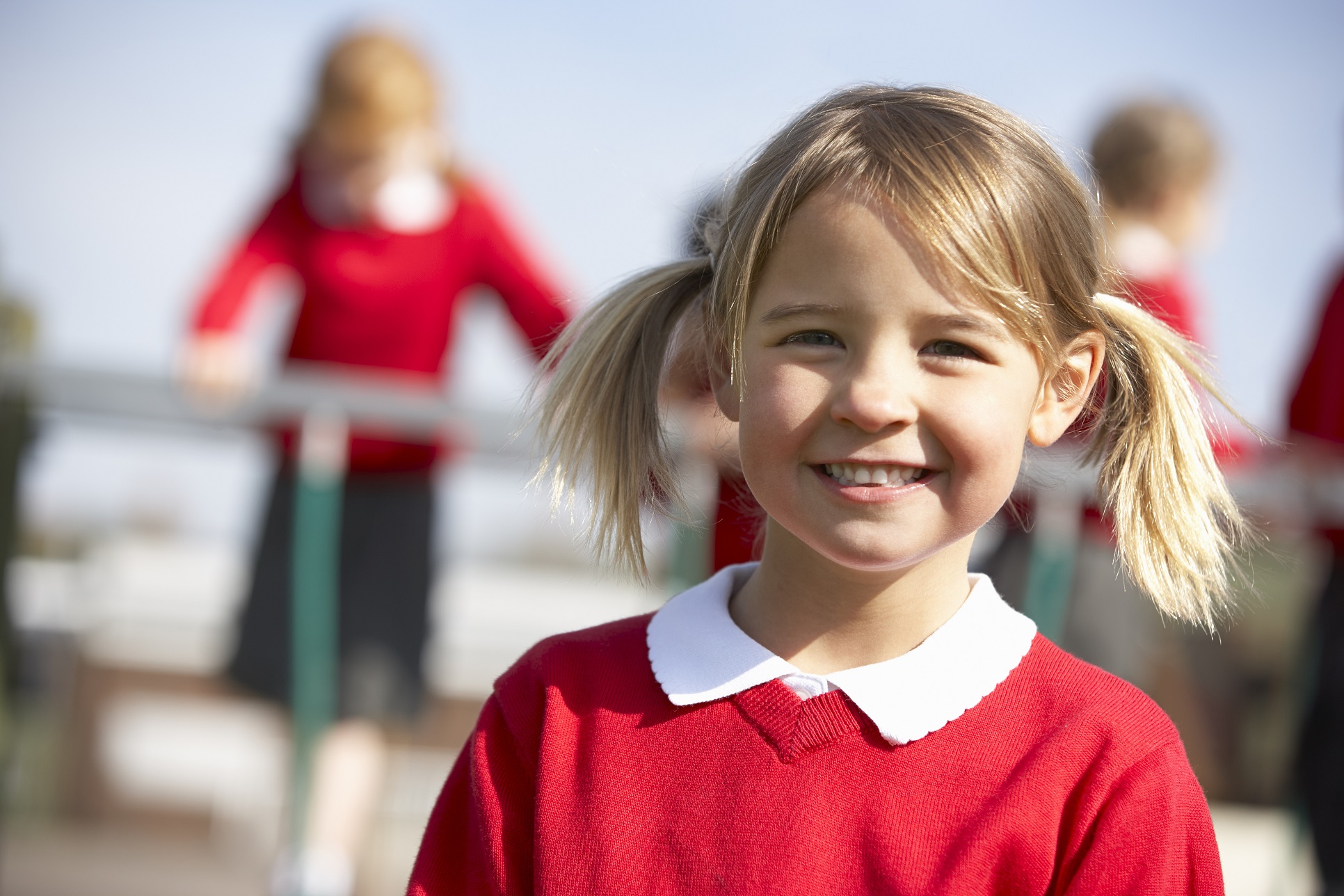 smiling girl in school uniform