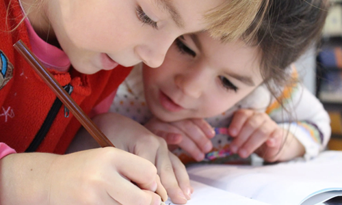 Girls writing a story