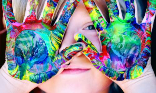 Girl painting her hands