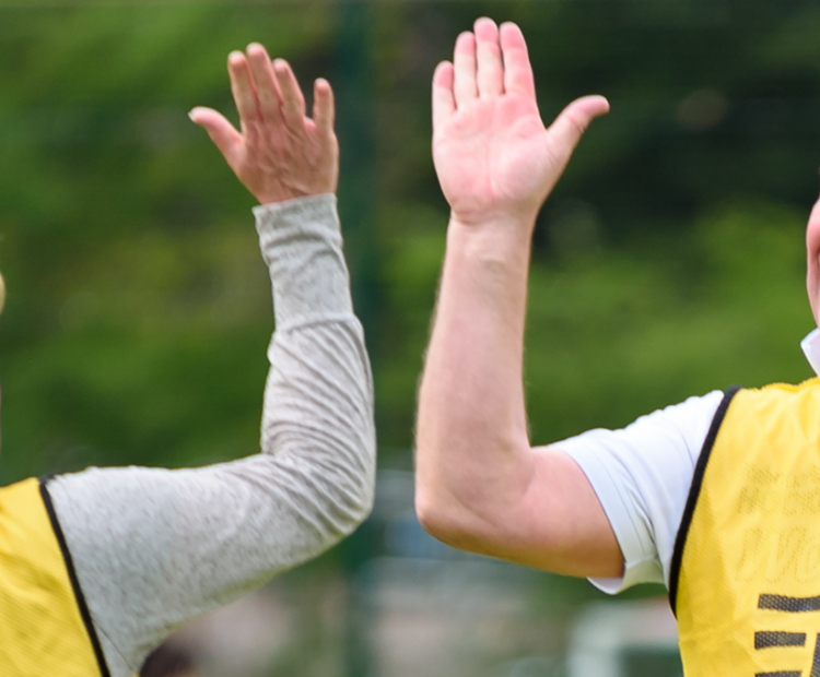 Man high fiving woman