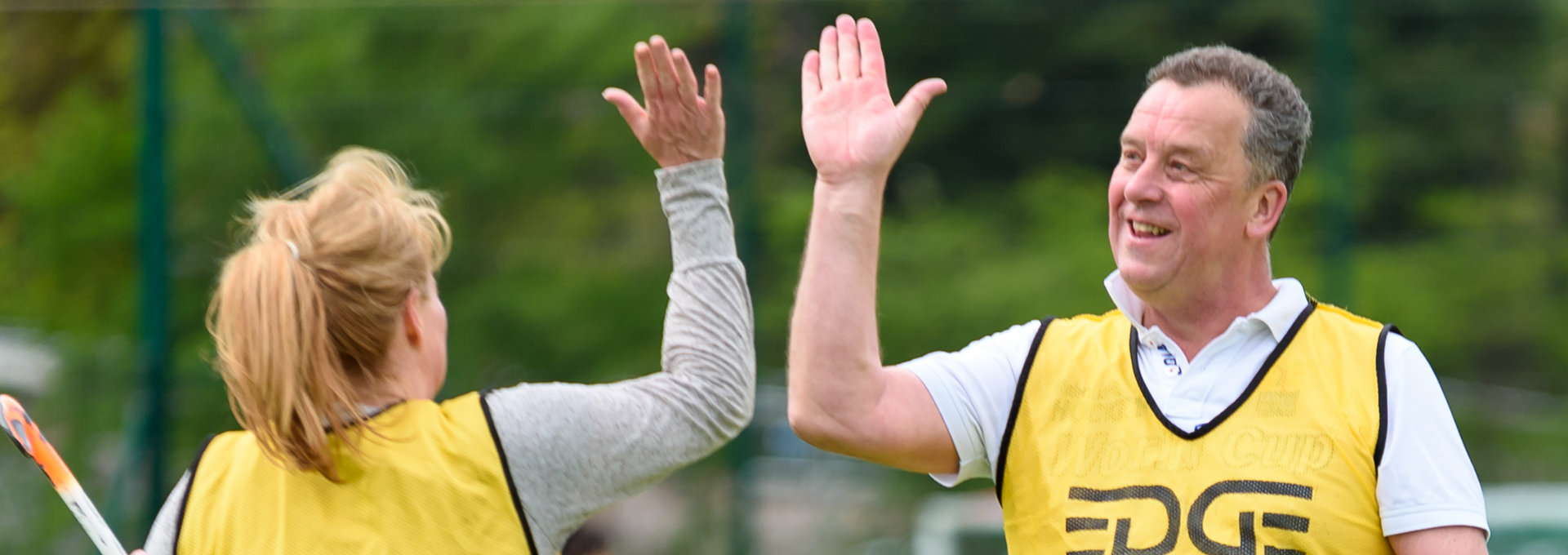 Man high fiving woman