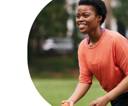 Woman playing catch with disabled friends