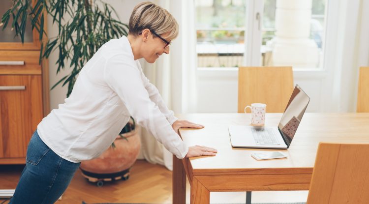 woman doing press ups on desk