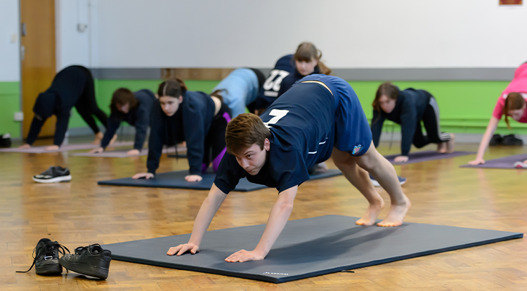 boy doing gymnastics at school