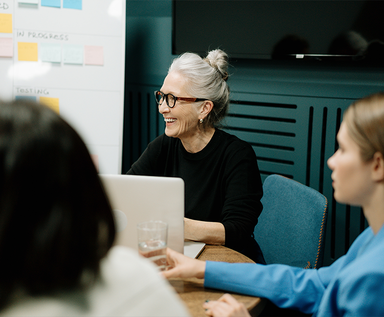 Smiling older employee in meeting