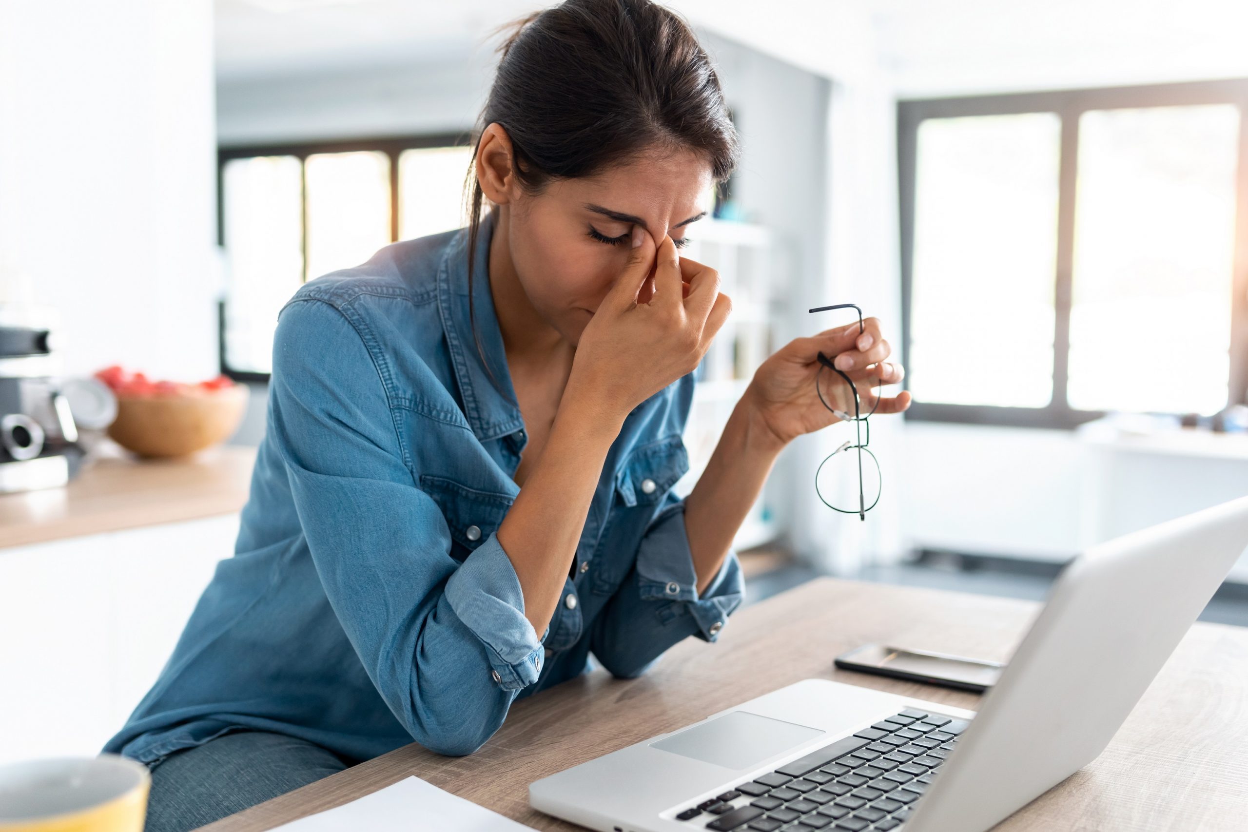 Woman experiencing fatigue at work