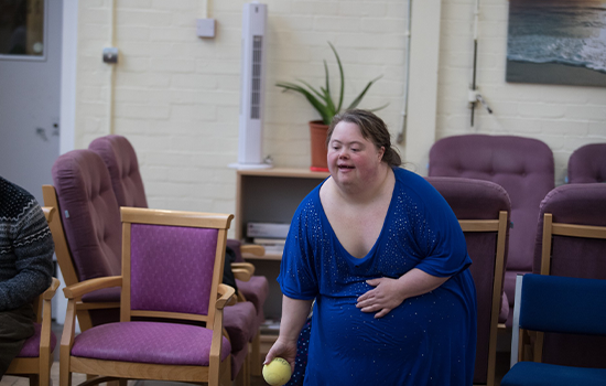 disabled woman throwing a ball