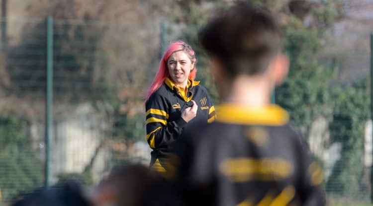 young woman rugby coach