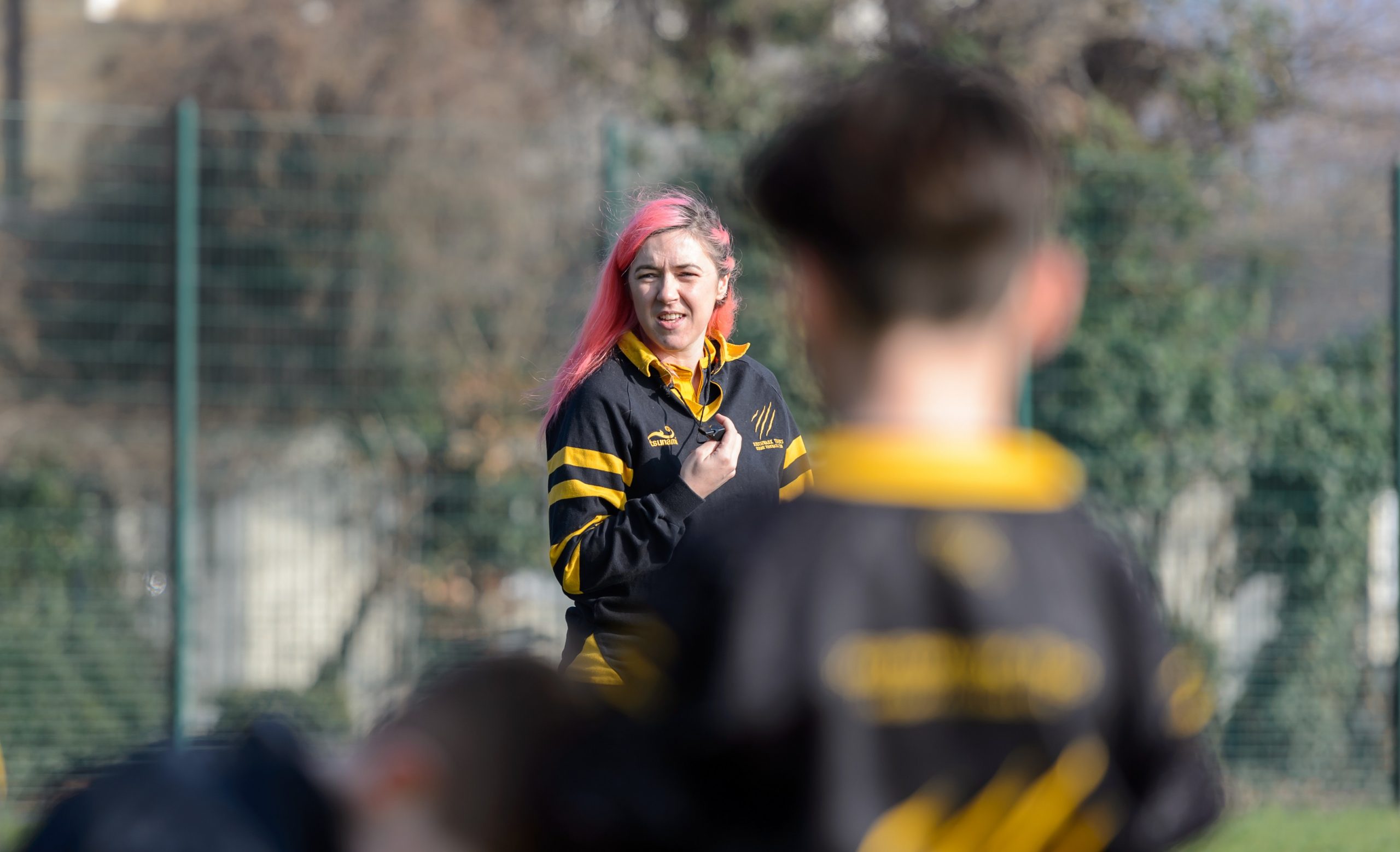 young woman rugby coach