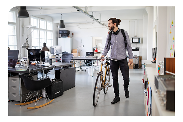 businessman with bike in office