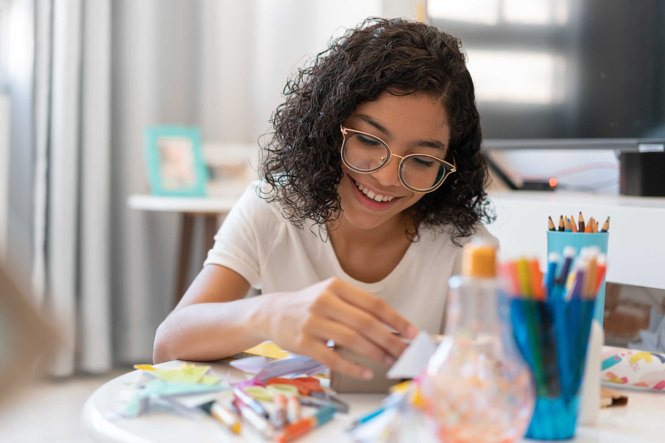 Teenage girl painting and drawing