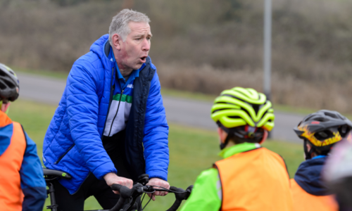 Man teaching kids cycling