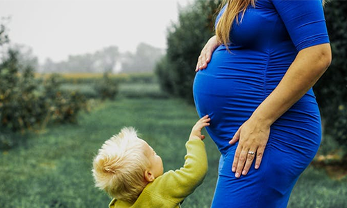 Pregnant woman with son