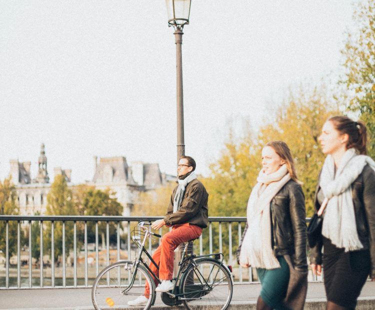 People cycling along a street