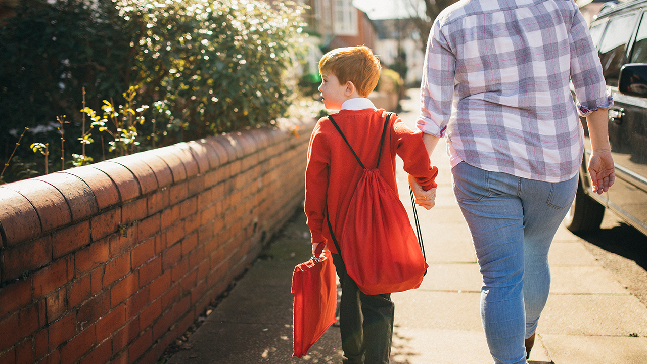 boy walks to school