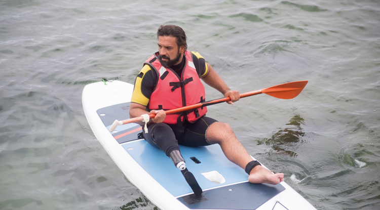 Man with amputated leg paddleboarding