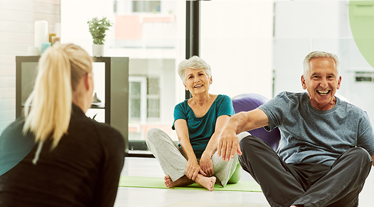 Older people doing a yoga class