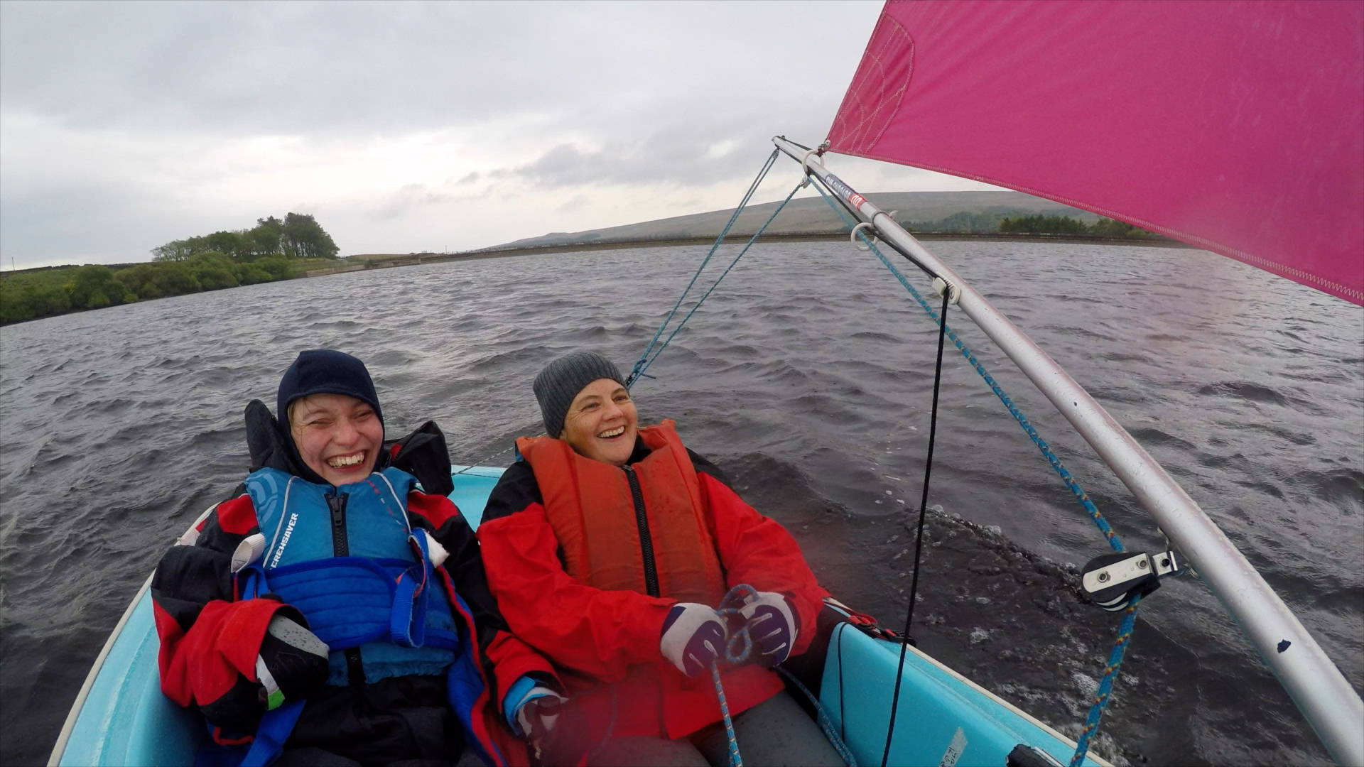 Two women laughing on a sailing boat